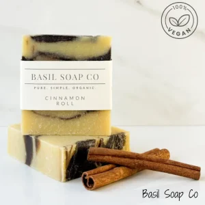 Cinnamon Roll_Vegan Main Image Cinnamon roll soap with Basil Soap label next to two cinnamon sticks